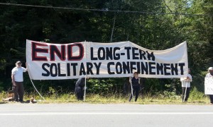 Humboldt-protesters-banner-End-Long-Term-Solitary-Confinement-outside-Pelican-Bay-prison-070813-courtesy-PHSS-Humboldt